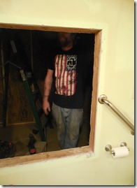 Mr. wearing his Rammstein shirt while renovating a bathroom